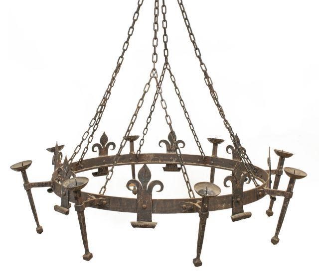 Appraisal: Palatial Gothic style hammered steel candle chandelier th c circular