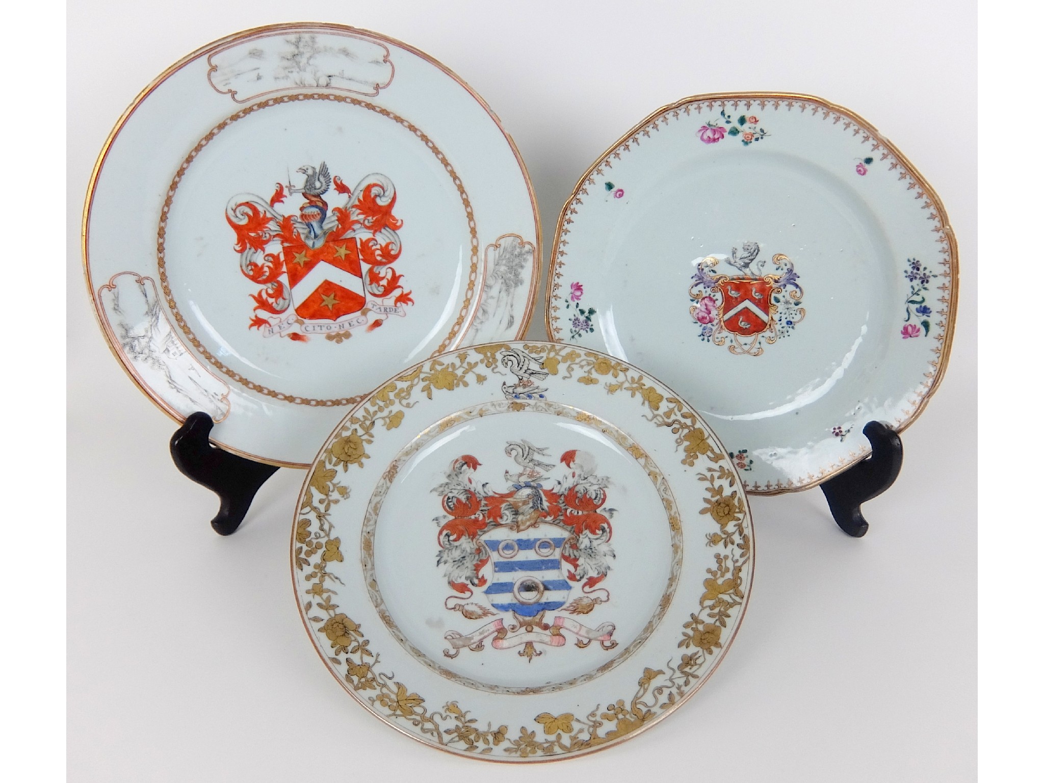 Appraisal: Three Chinese export armorial plateseach printed with a coat of