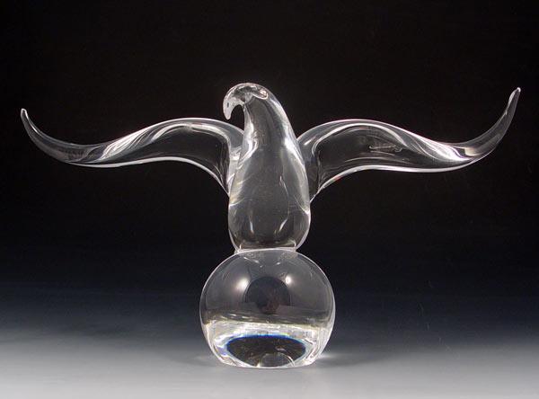 Appraisal: JAMES HOUSTON STEUBEN GLASS EAGLE Figural eagle on ball Designed