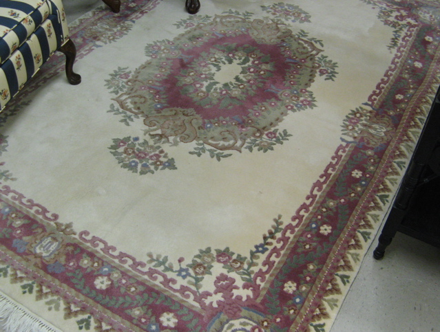 Appraisal: ORIENTAL INDO-AUBUSSON CARPET central French floral medallion on plain ivory