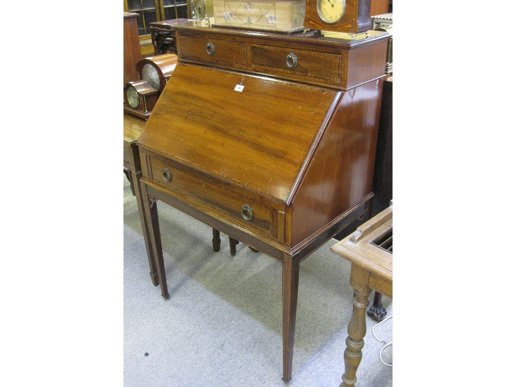 Appraisal: Mahogany writing desk with pair of drawers above slopefront