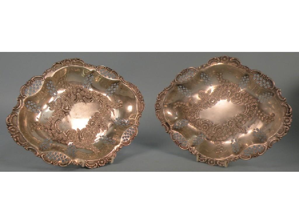 Appraisal: A pair of lozenge shaped silver dishes cast with scrolls