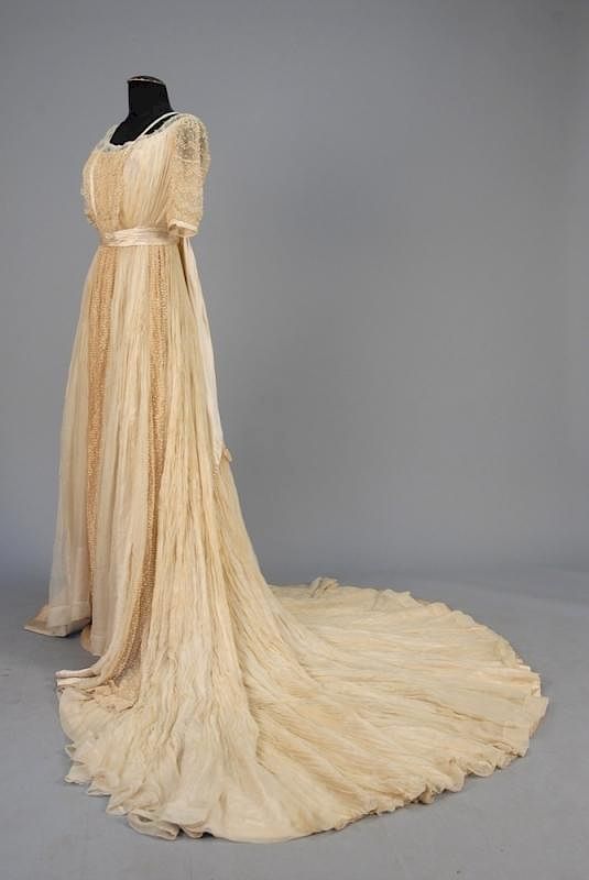 Appraisal: TRAINED EDWARDIAN SILK WEDDING GOWN Pleated ivory chiffon over satin