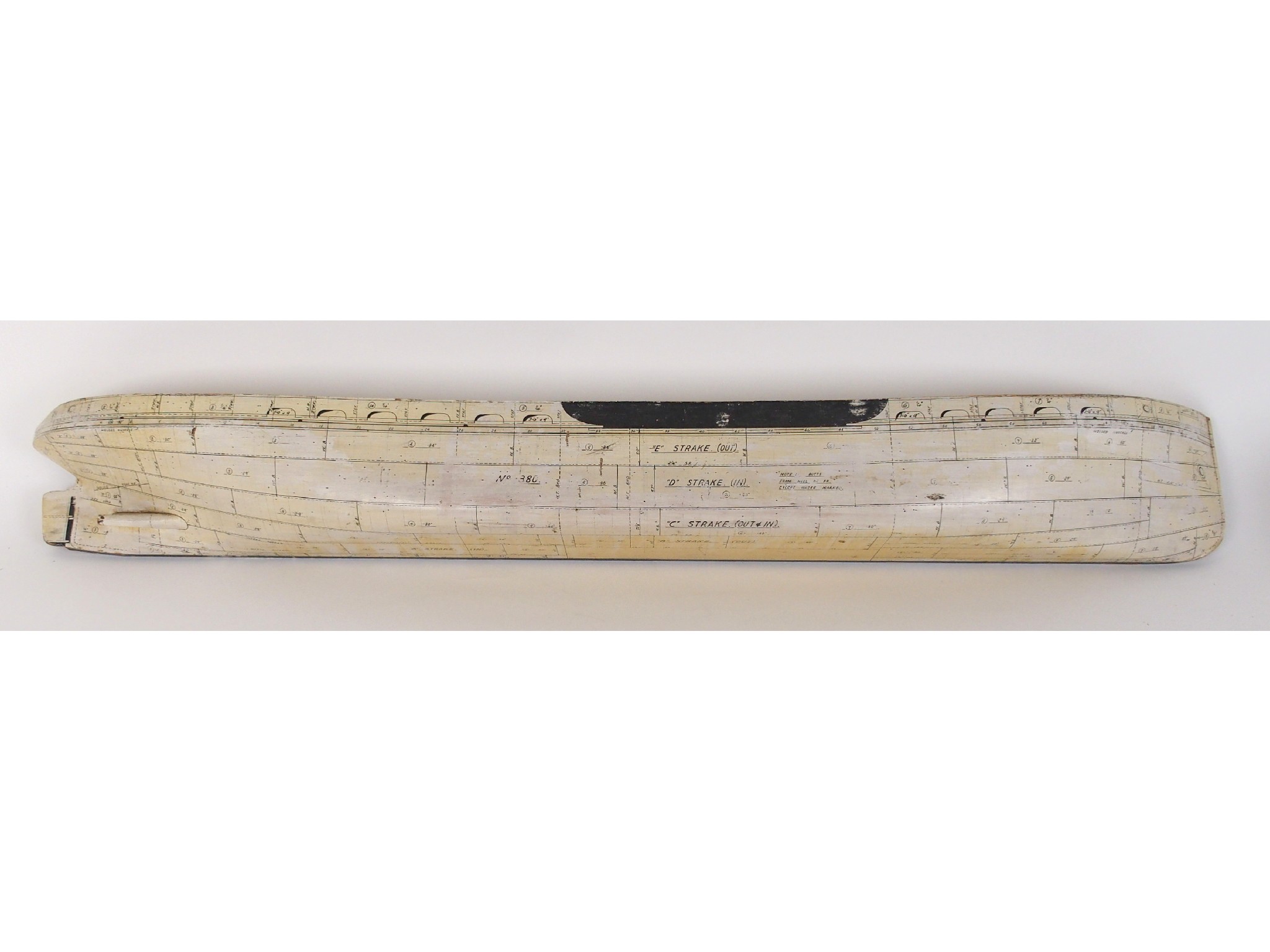 Appraisal: A Shipbuilder's half hull modelpainted white with markings for Strakes