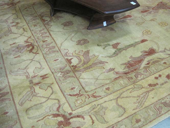 Appraisal: HAND KNOTTED ORIENTAL CARPET Turkish Oushak design of stylized flowers