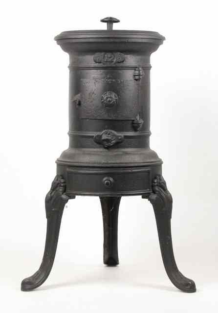 Appraisal: A reproduction cast iron stove marked to fit a gypsy