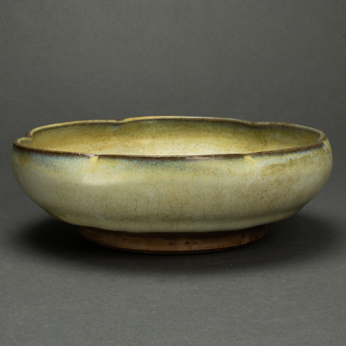 Appraisal: Chinese Jun glazed bowl with a foliated rim and unglazed