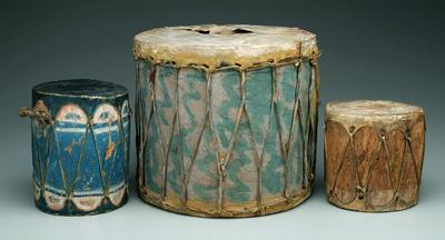 Appraisal: Three wood and hide drums one with blue decoration old