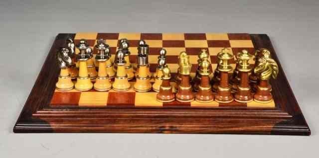 Appraisal: BRASS WOOD ITALIAN CHESS SETItalian brass chess pieces on a