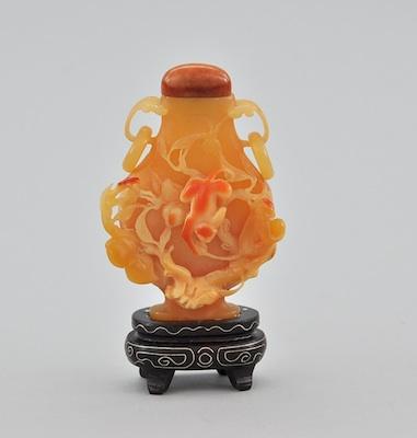 Appraisal: A Carved Hornbill Snuff Bottle Urn shaped bottle with handles