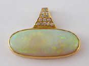 Appraisal: A yellow metal tests carat gold opal and diamond pendant