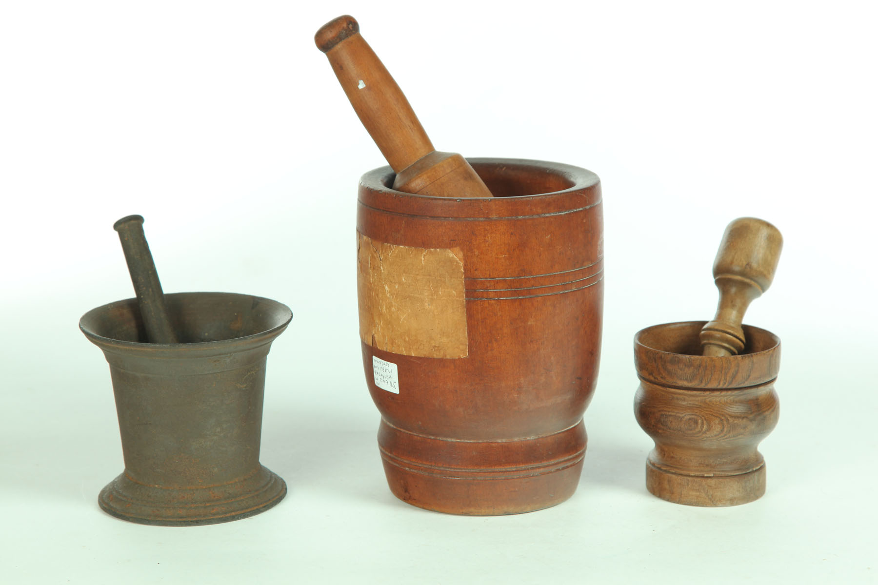 Appraisal: THREE MORTARS AND PESTLES American and English th century Two