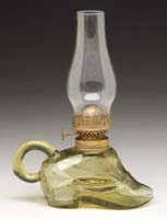 Appraisal: RARE ATTERBURY SHOE MINI LAMP S - Amber glass shoe