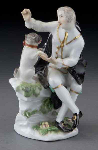 Appraisal: Meissen porcelain figure of a gentleman and pugdog sitting on