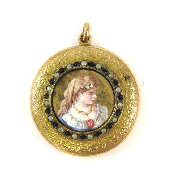 Appraisal: TEN KARAT YELLOW GOLD LOCKET with round-cut sapphires and seed