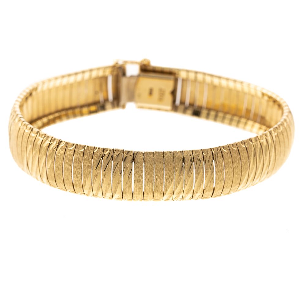 Appraisal: A Wide Omega Bracelet in K K yellow gold Omega