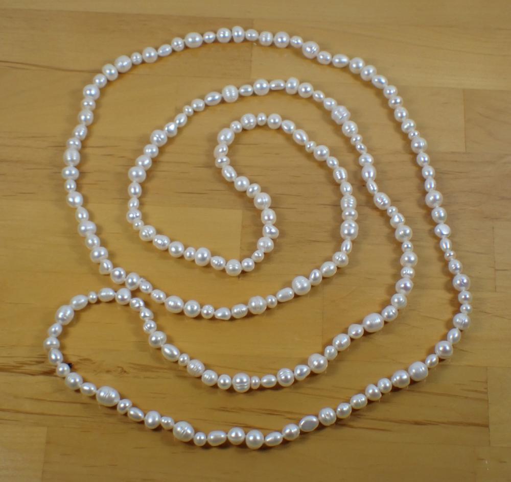 Appraisal: ROPE LENGTH BAROQUE WHITE PEARL NECKLACE The hand-knotted strand with