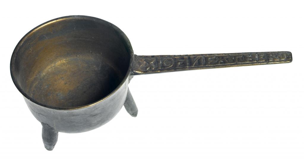 Appraisal: AN ENGLISH LEAD-BRONZE SKILLET the handle cast with the inscription