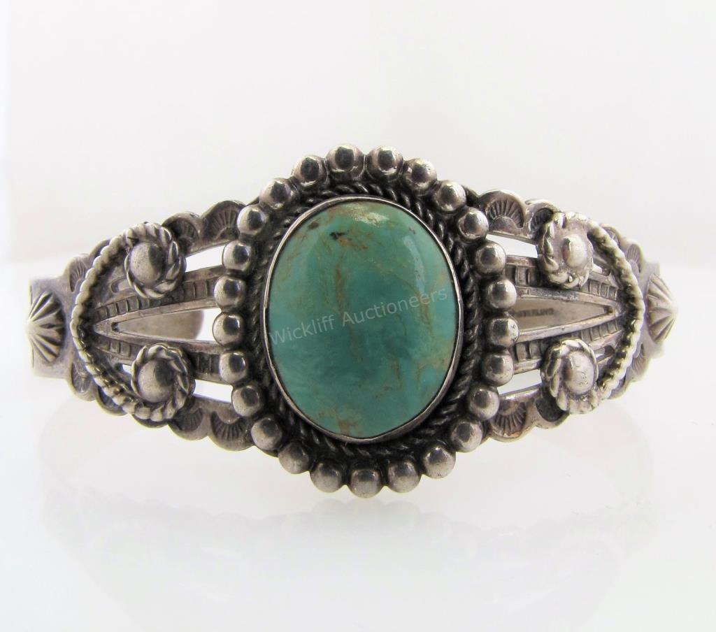 Appraisal: A sterling silver cuff bracelet with an oval turquoise unmarked