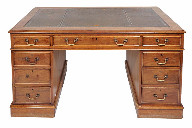 Appraisal: A MAHOGANY PEDESTAL DESK with green leather inset top cm