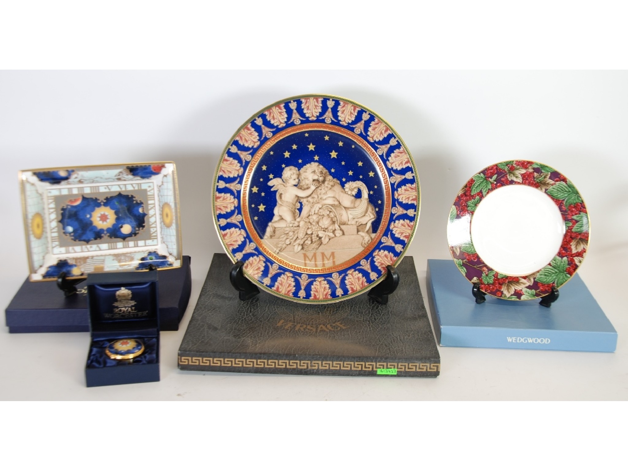 Appraisal: ROSENTHAL VERSACE 'CHRISTMASTIDE' PORCELAIN PLATE printed with cherub and lion