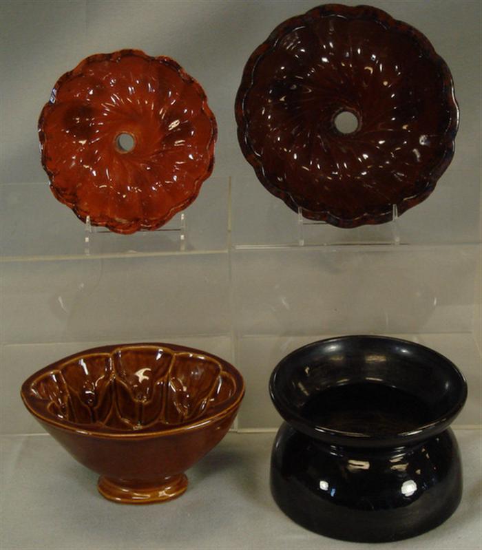 Appraisal: redware turks head molds with manganese decoration redware spittoon Bennington