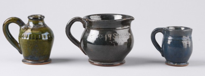 Appraisal: Lot of three One small pitcher with dark glaze incised