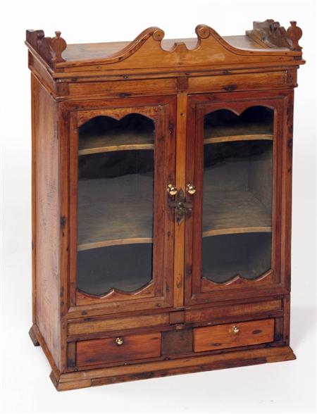 Appraisal: A th century country pine medicine cabinet the swan-neck pediment