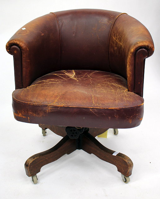 Appraisal: AN OLD BURGUNDY LEATHER SWIVEL DESK CHAIR together with a