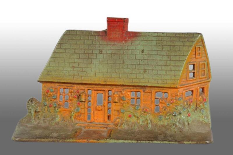 Appraisal: Cast Iron Cape Cod Cottage Doorstop Description Made by National