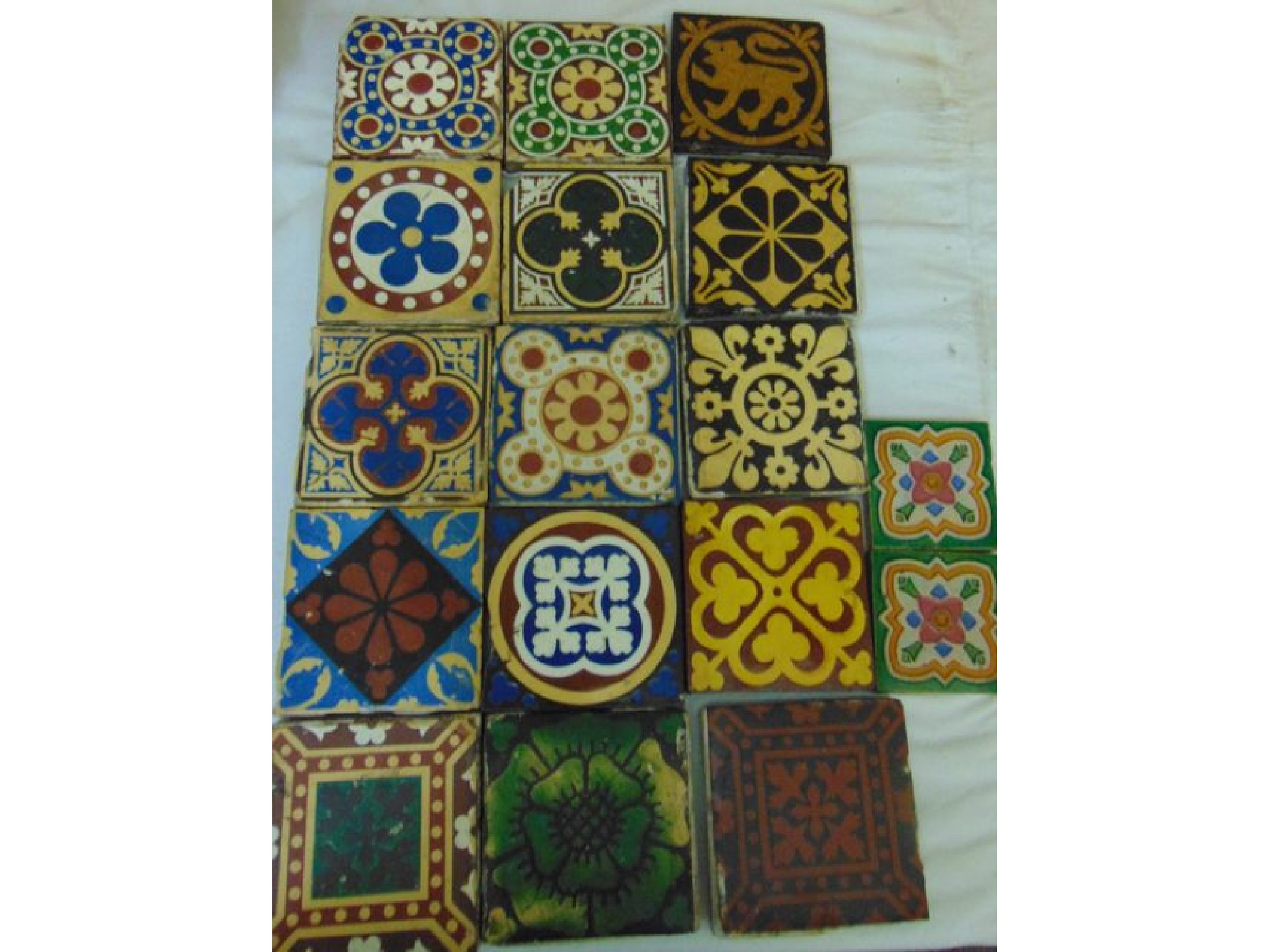 Appraisal: A collection of th century ceramic floor tiles mainly in