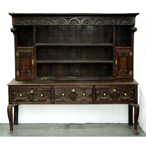 Appraisal: An oak dresser th c the associated boarded rack with