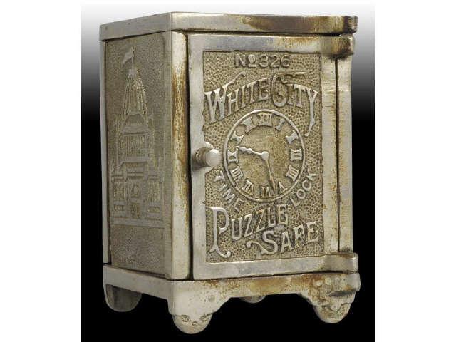 Appraisal: Cast Iron White City Puzzle Safe Still Bank Description Made