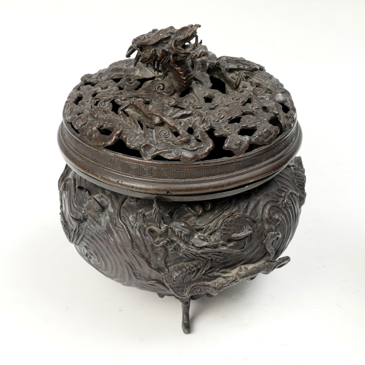 Appraisal: HIGH RELIEF BRONZE DRAGON CENSOR Meiji period sculpted bronze vase