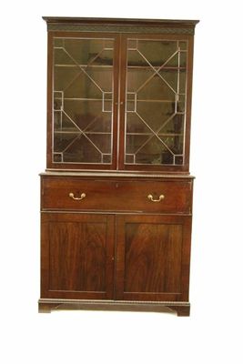 Appraisal: A th century mahogany secretaire bookcase the blind fret cornice