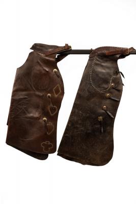 Appraisal: A pair of leather Western chaps decorated with brass studded