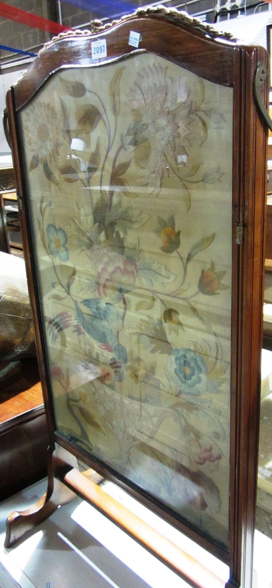 Appraisal: A th century walnut fire screen with silk work panel