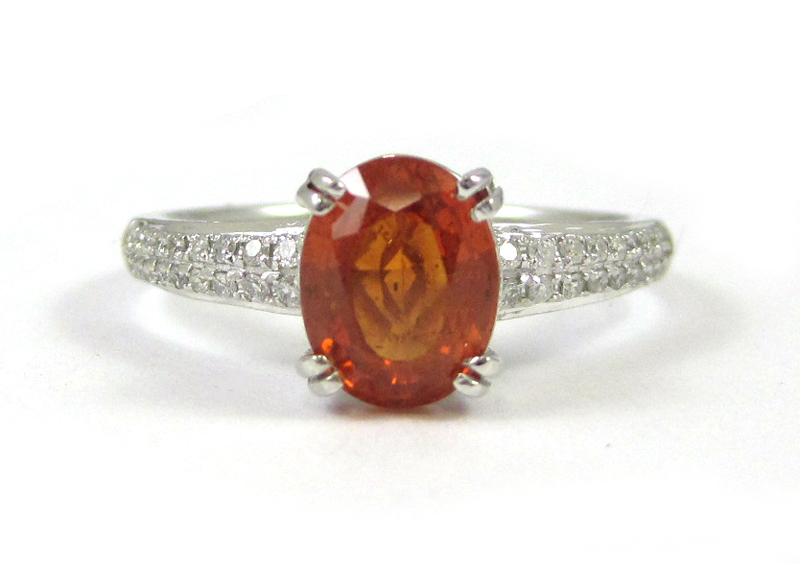 Appraisal: ORANGE SAPPHIRE AND DIAMOND RING k white gold with round-cut