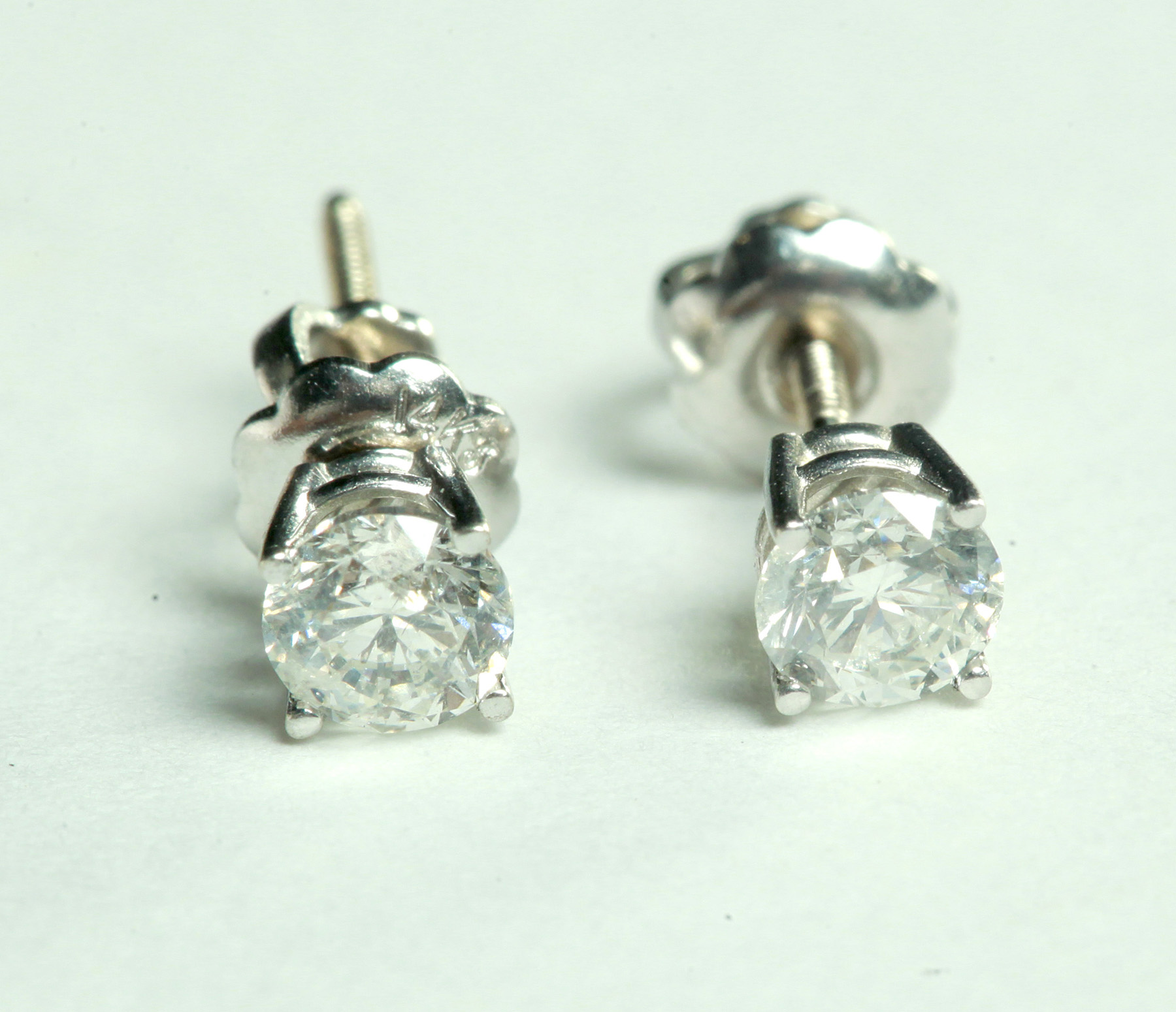 Appraisal: PAIR OF DIAMOND STUD EARRINGS American th century k white