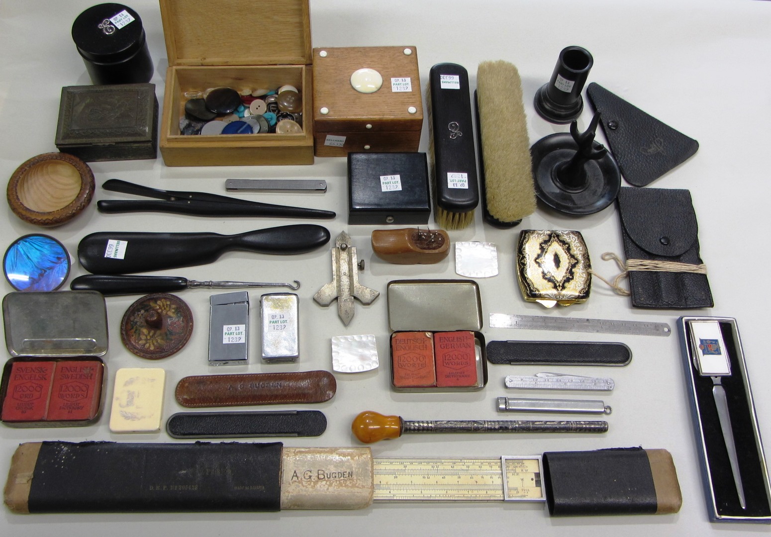 Appraisal: An ebony part dressing table set comprising two clothes brushes