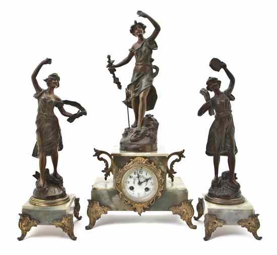 Appraisal: A French Bronze and Onyx Three-Piece Clock Garniture the clock