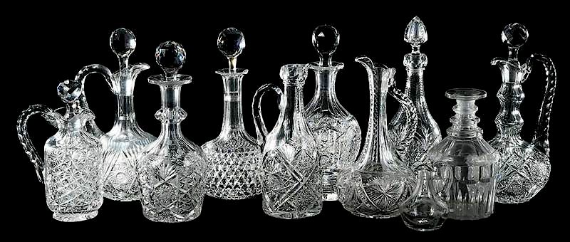 Appraisal: Eleven Cut Glass Decanters handled liquor decanter with spout no