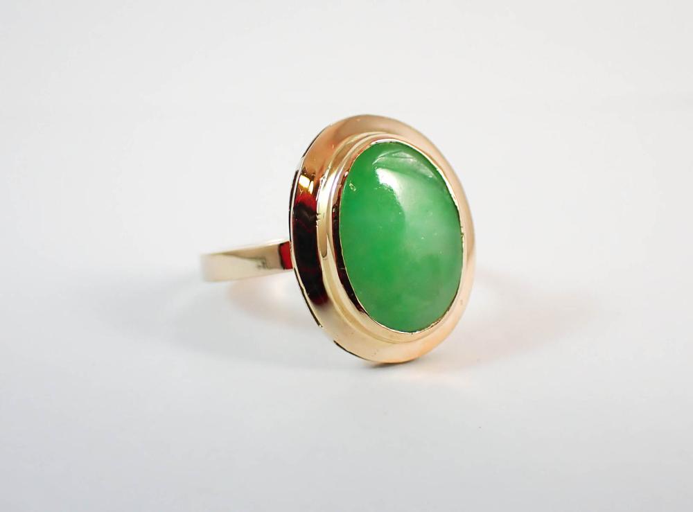 Appraisal: JADEITE JADE AND FOURTEEN KARAT GOLD RING bezel set with