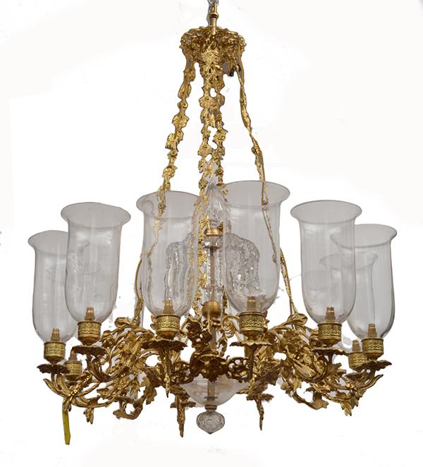 Appraisal: A ROCOCO STYLE GILTMETAL AND GLASS CHANDELIER with twelve branches