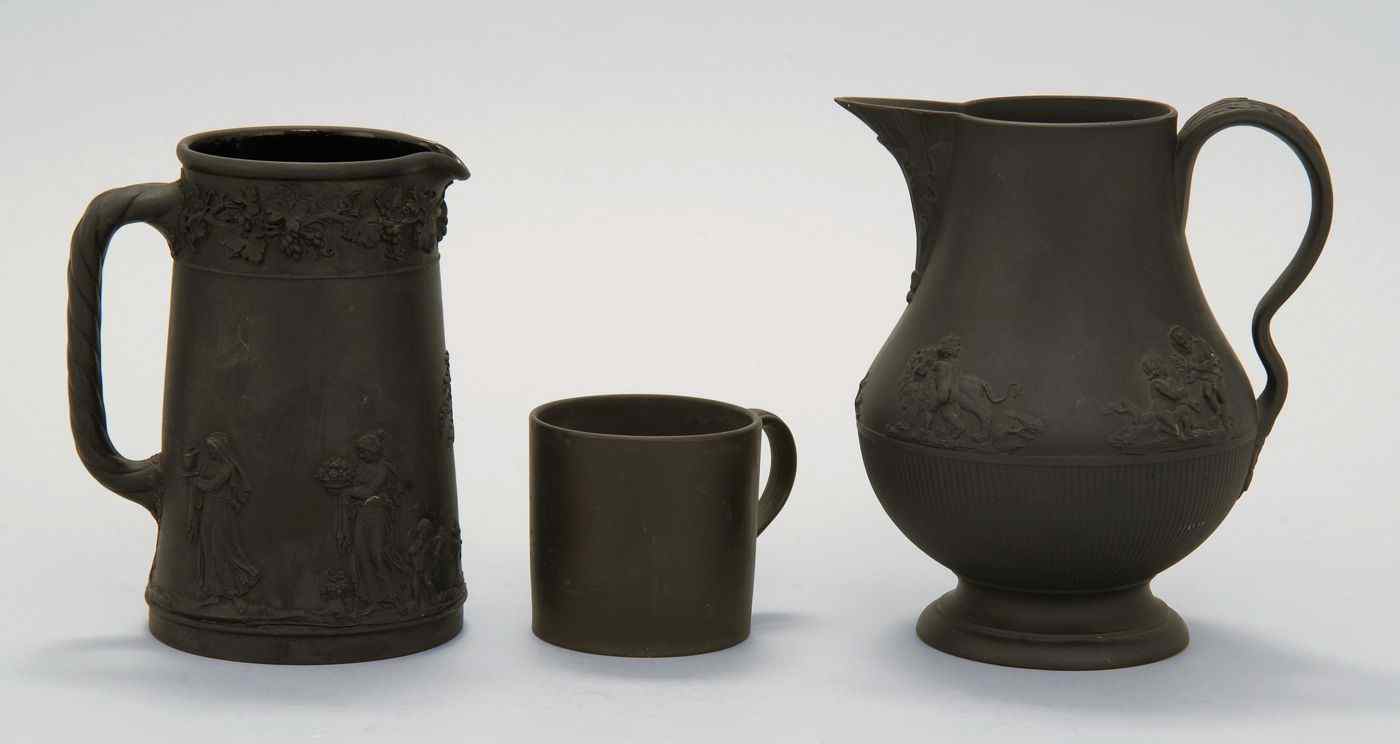 Appraisal: THREE PIECES OF BLACK BASALT th CenturyA classical decorated pitcher