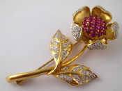 Appraisal: A yellow metal tests carat gold ruby and diamond brooch