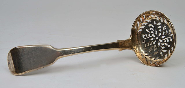 Appraisal: A WILLIAM IV SILVER SUGAR SIFTER with foliate pierced bowl