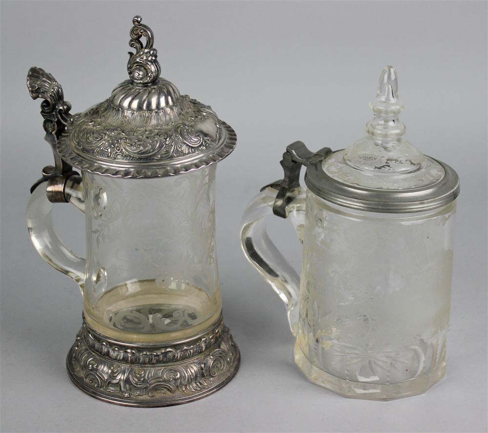 Appraisal: TWO GERMAN PEWTER MOUNTED ENGRAVED GLASS STEINS th th Century