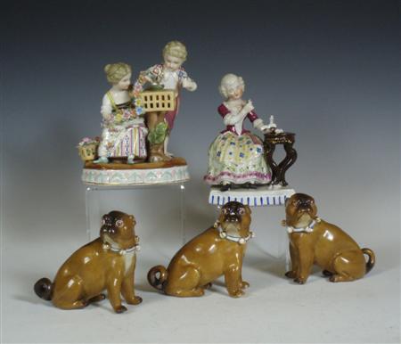 Appraisal: Three pottery figures of pugs each sitting with a large