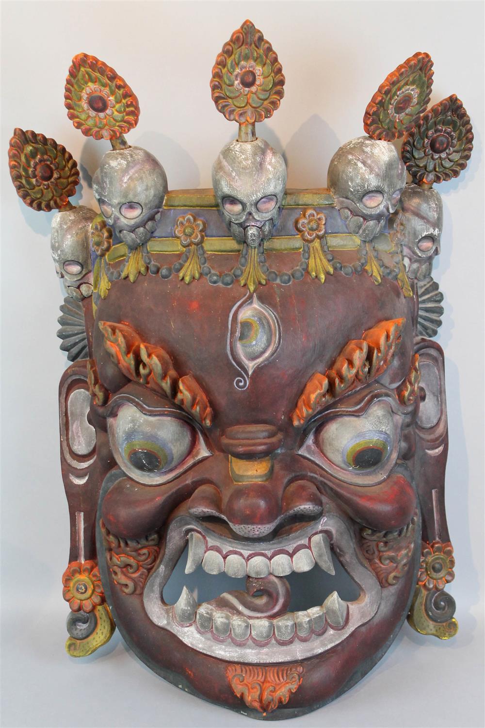 Appraisal: HIMALAYAN TIBET MAHAKALA SKULL POLYCHROME CARVED MASK Tibetans originally painted